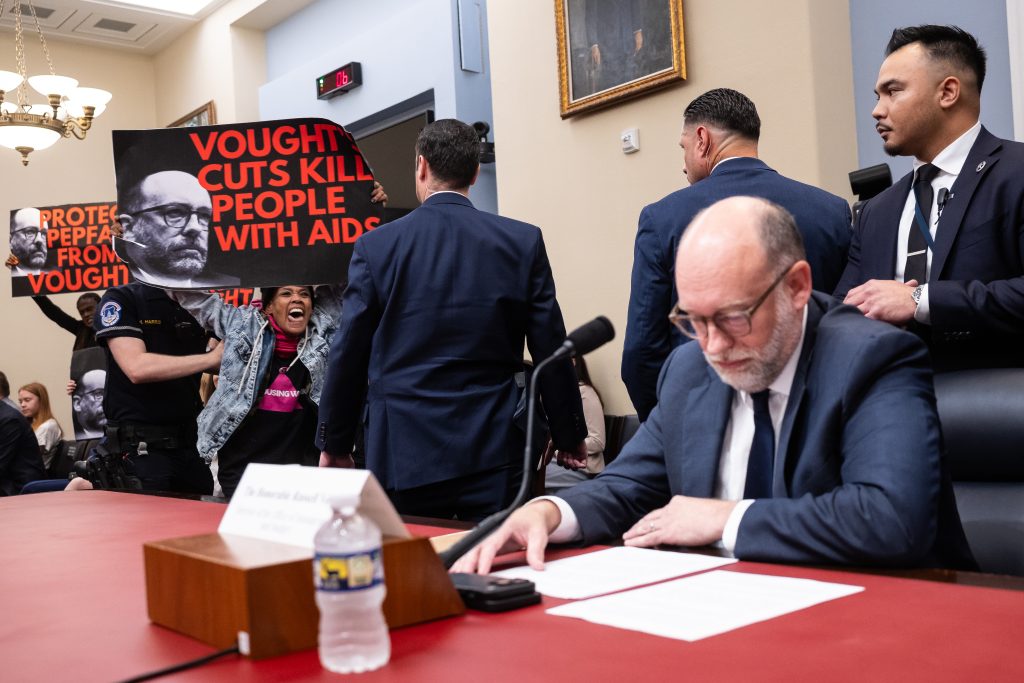“AIDS Activists Take a Stand: Disrupting Vought’s Testimony on Trump’s Budget Cuts”